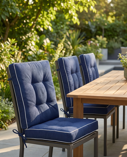 Navy high-back outdoor chair cushions with ties on patio dining chairs