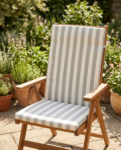 Grey and cream striped high-back chair cushion on a folding garden chair