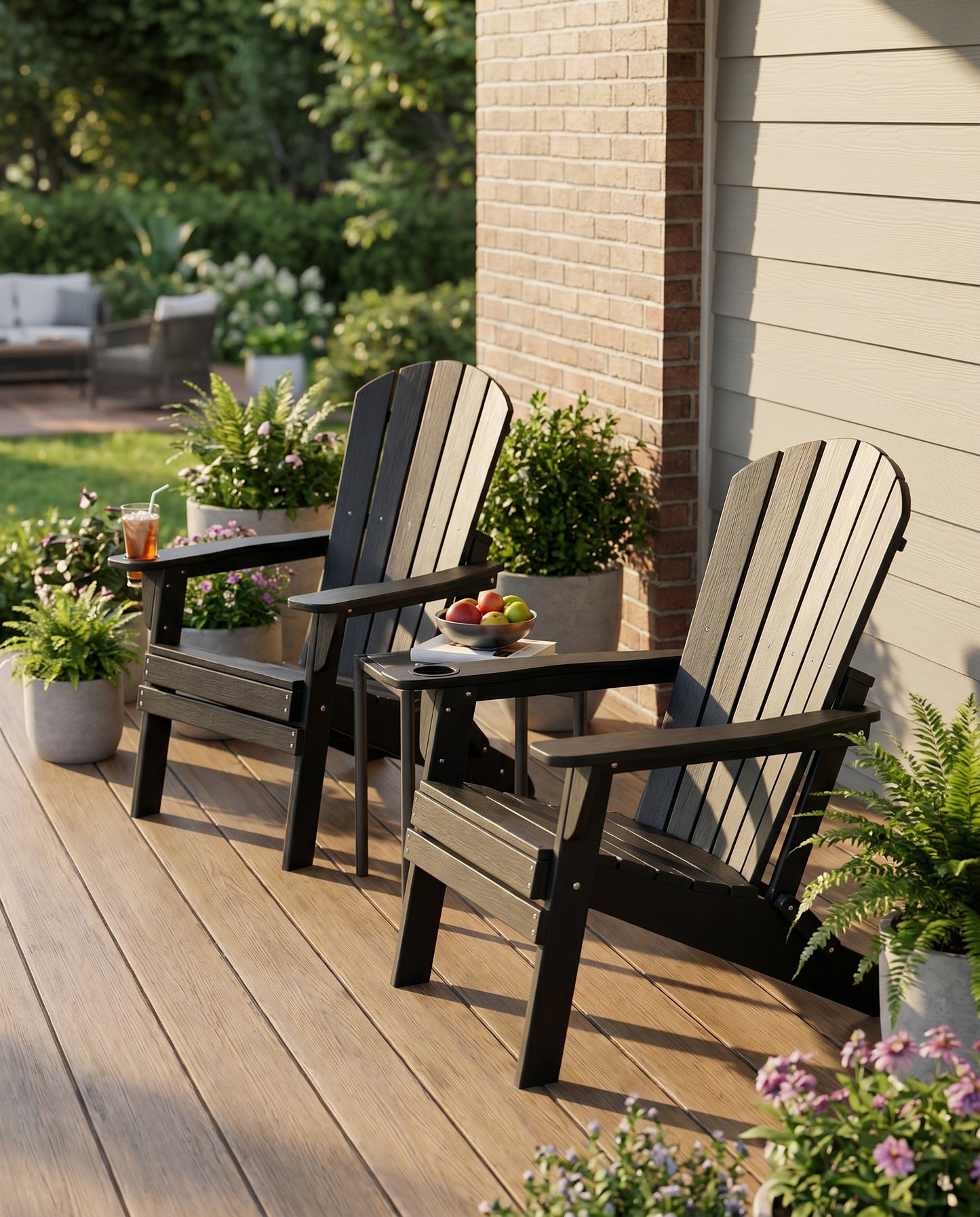 Black folding HDPE Adirondack chairs with cup holders on a deck porch