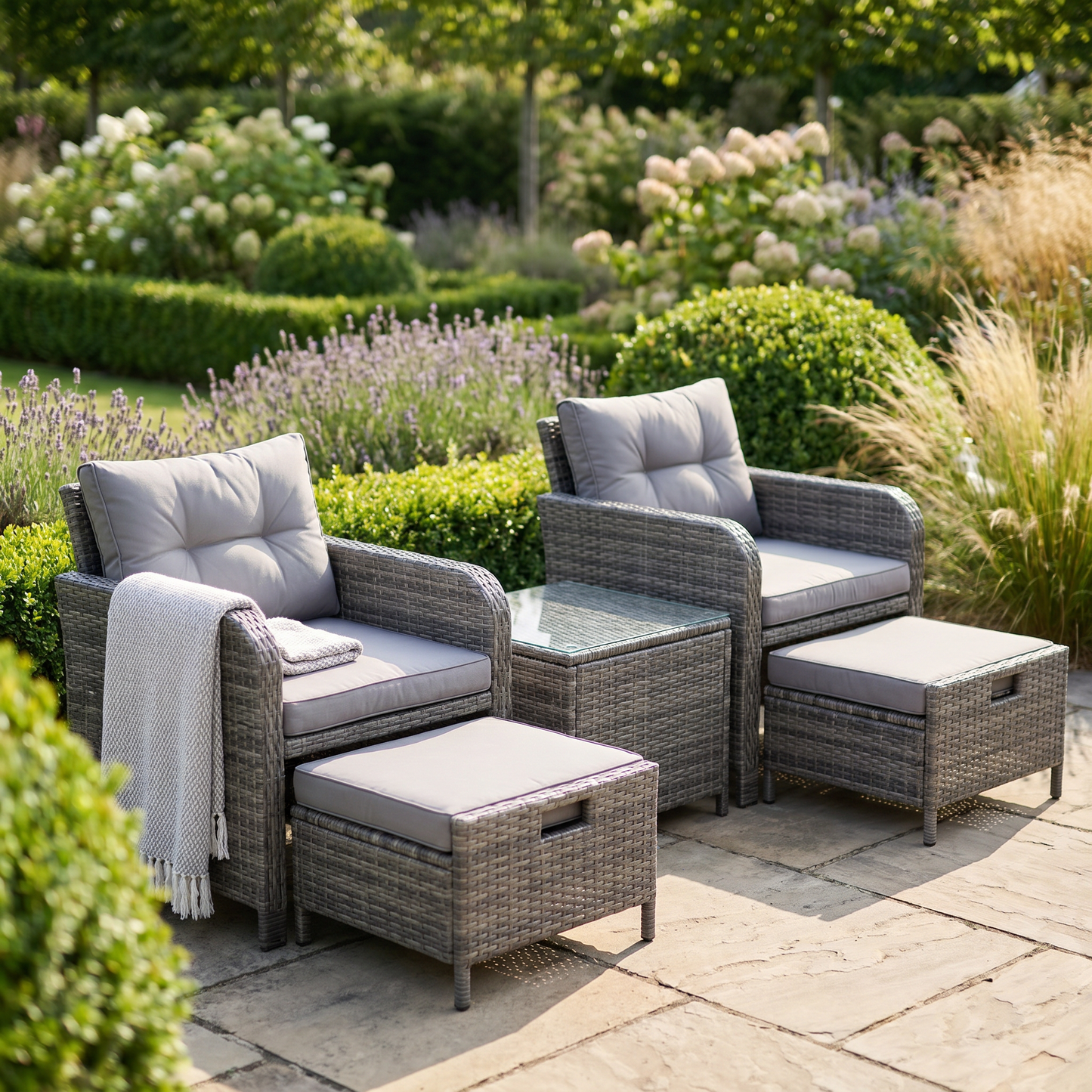 5-piece grey wicker patio set in a temperate garden, square