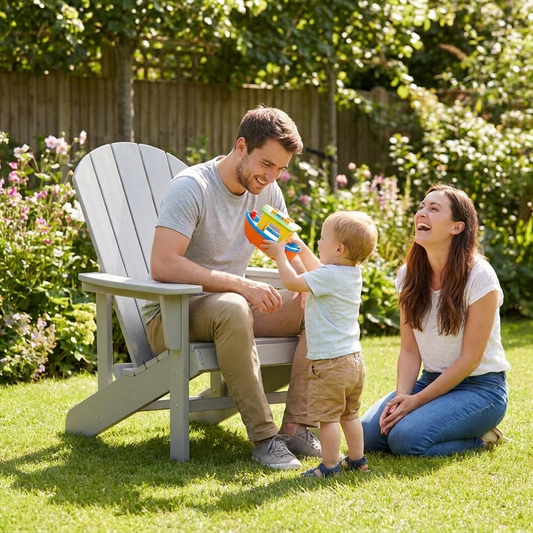 Dad in Adirondack chair playing with his child
