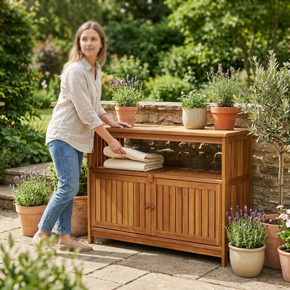 Acacia patio sideboard with slatted storage doors and open shelf on a garden terrace